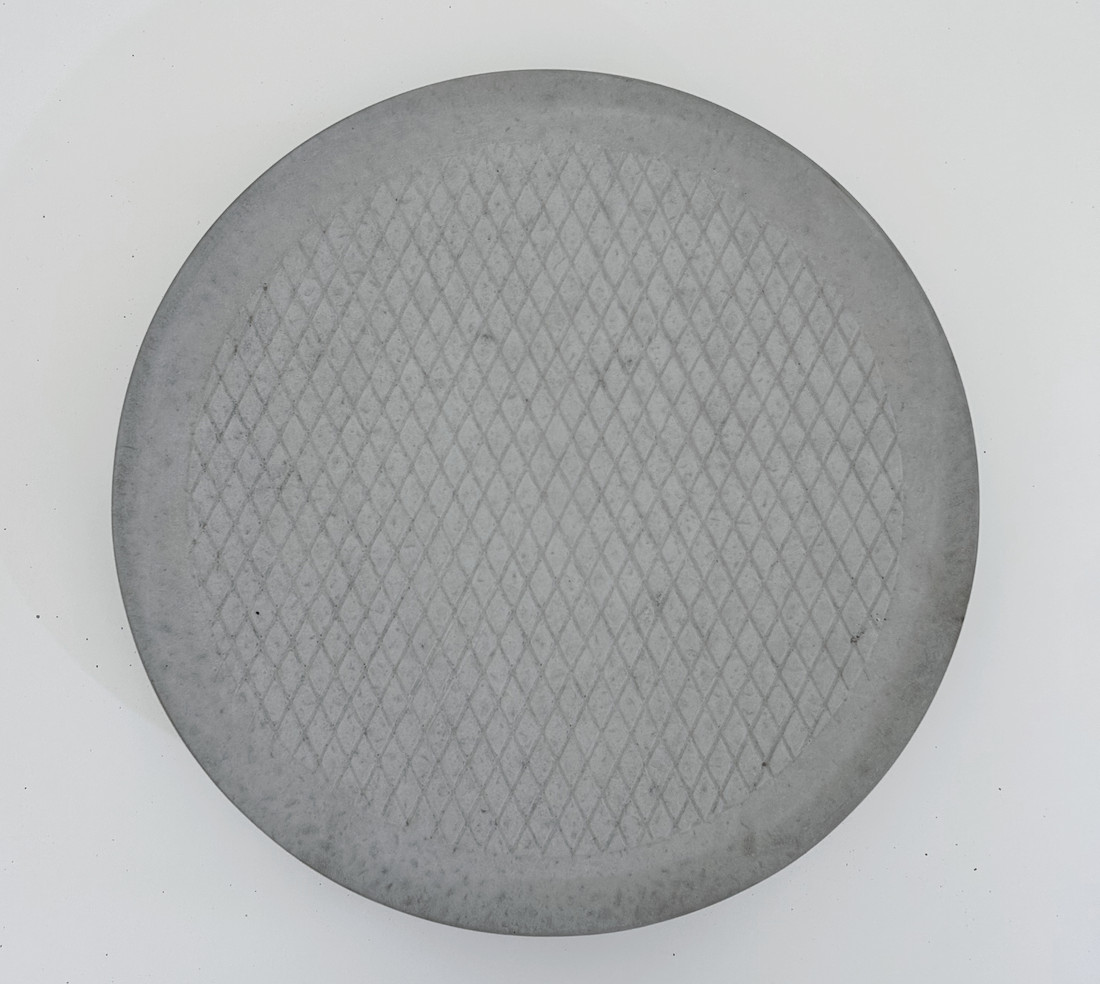 Diamond pattern precast concrete patio circle by Rocky Mountain Concrete
