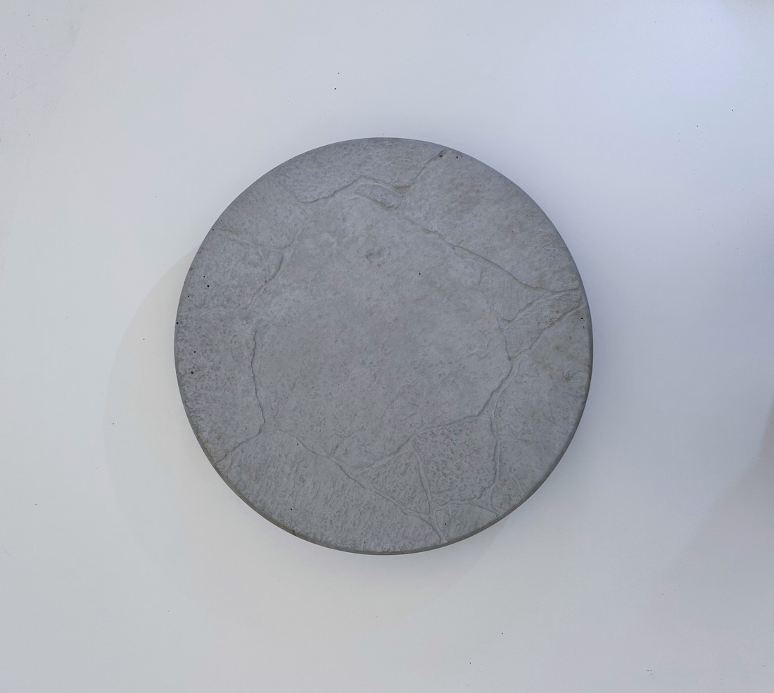 Slate texture precast concrete patio circle by Rocky Mountain Concrete
