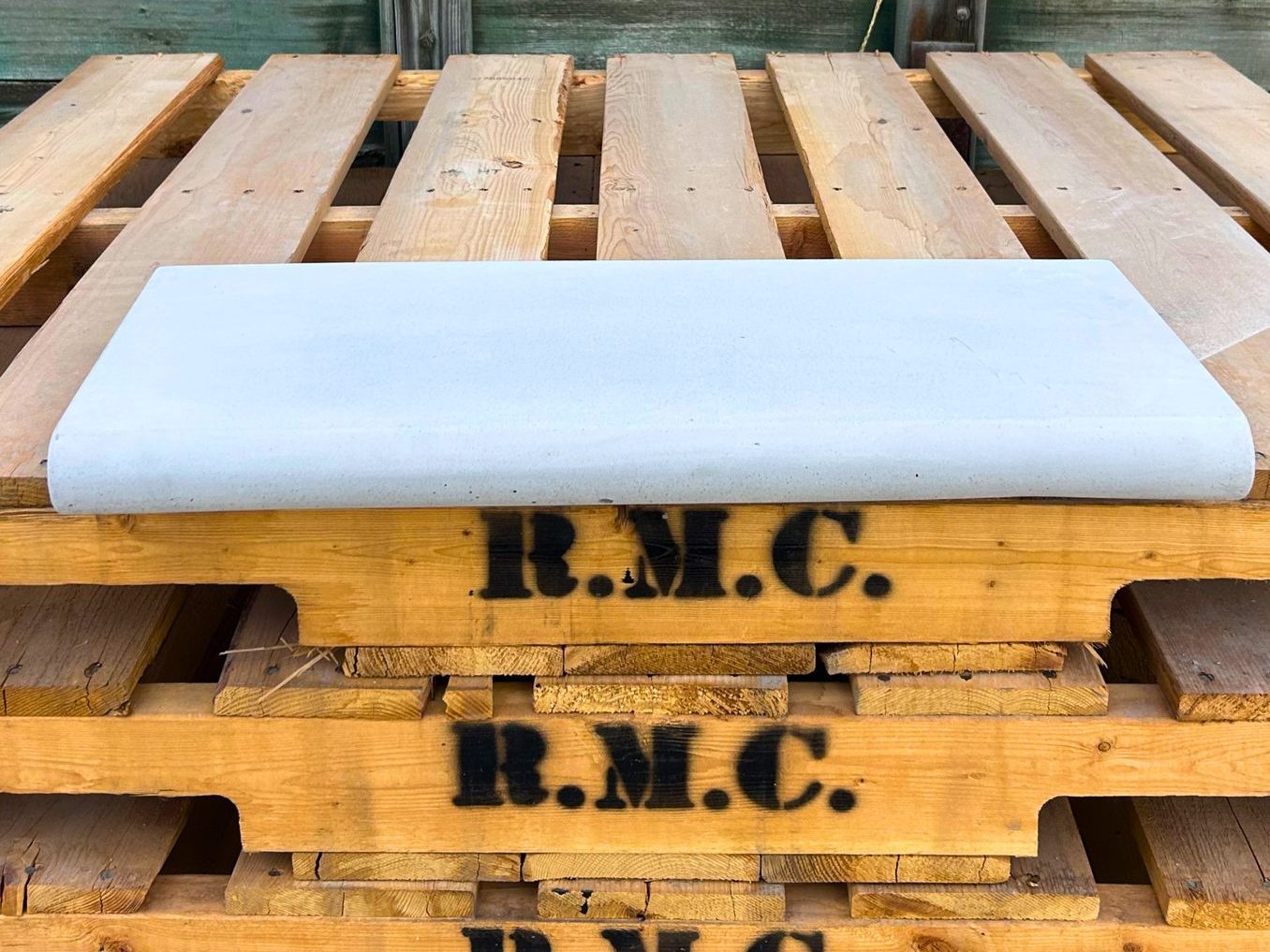 Light grey bullnose concrete pool coping cap on a Rocky Mountain Concrete pallet