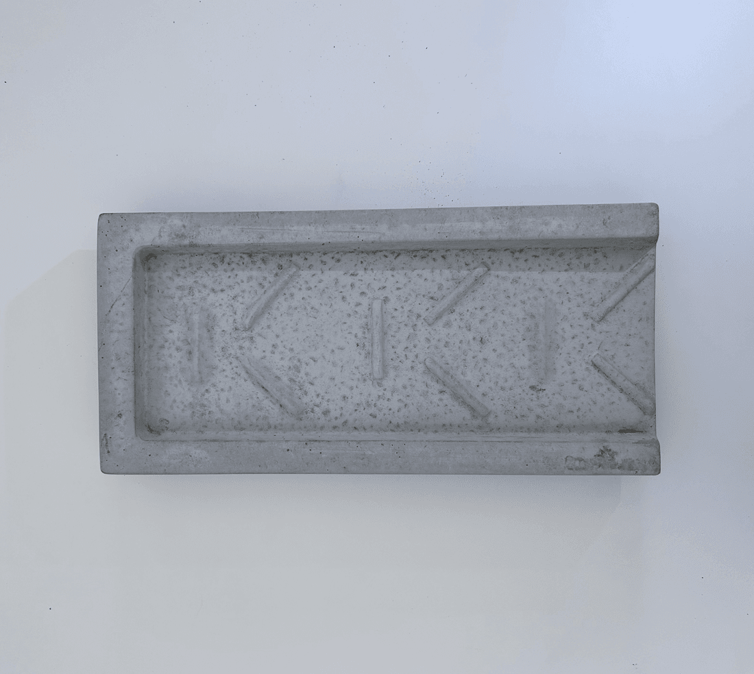 Precast concrete downspout splash guard by Rocky Mountain Concrete